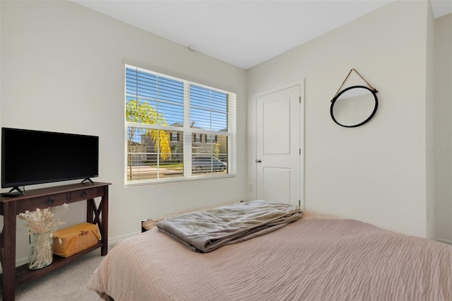 bedroom featuring light colored carpet