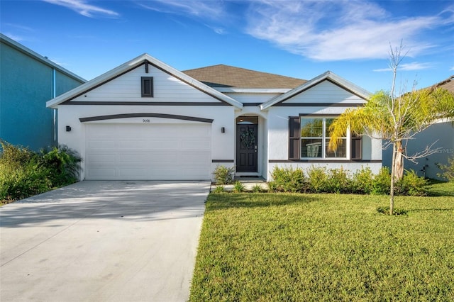 view of front of house featuring a garage and a front lawn