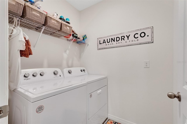 laundry room with separate washer and dryer