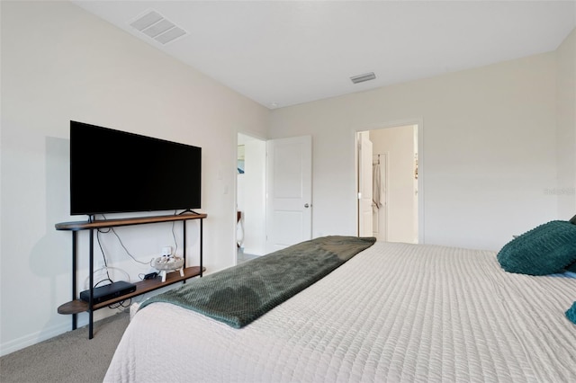 carpeted bedroom featuring connected bathroom