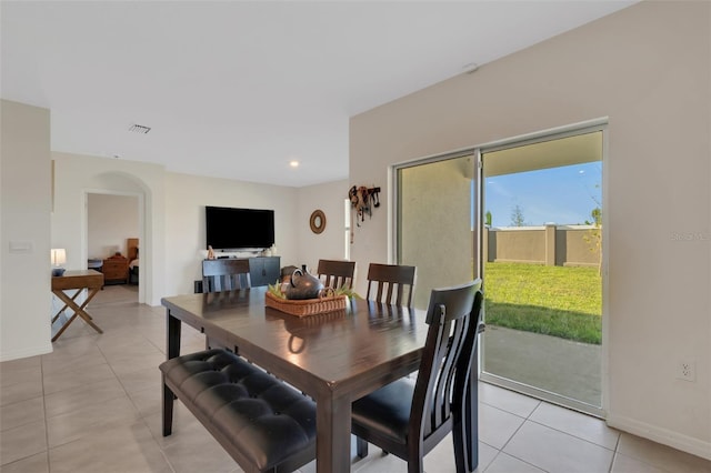 dining area featuring light tile patterned floors