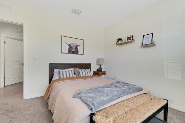 bedroom with light carpet