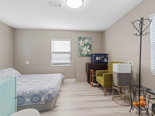 bedroom featuring light wood-type flooring