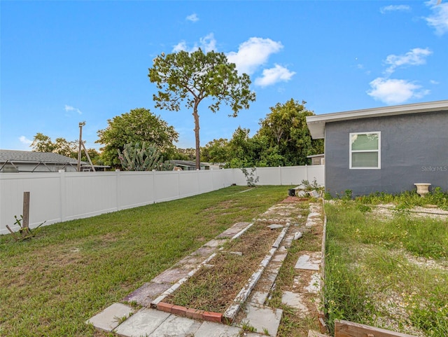 view of yard featuring a fenced backyard