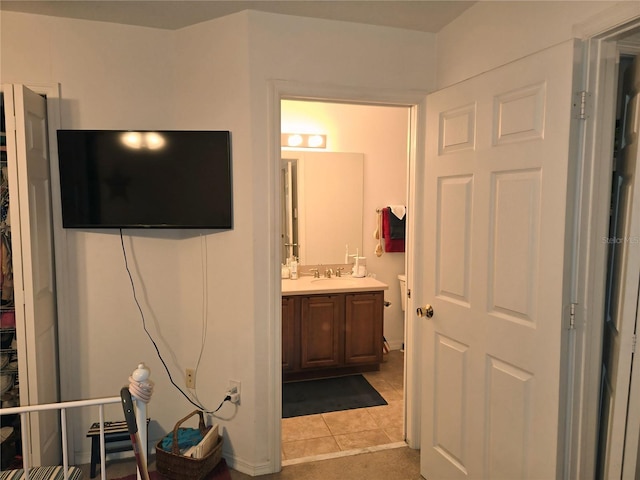 bathroom with tile patterned flooring and vanity