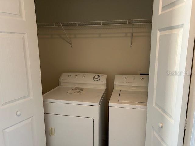 washroom with washer and dryer