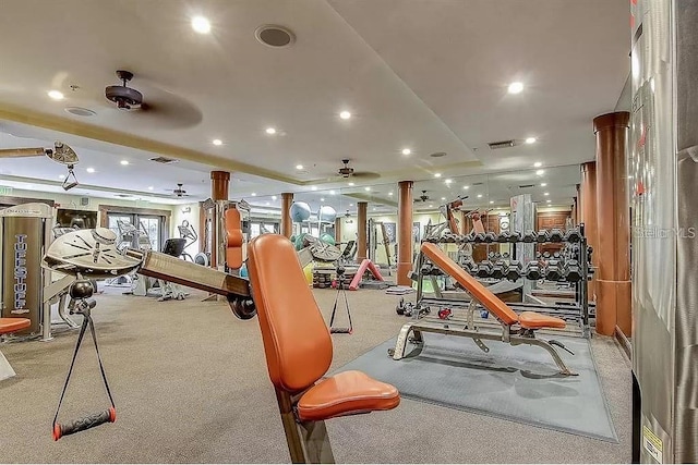 exercise room with light carpet, decorative columns, and ceiling fan