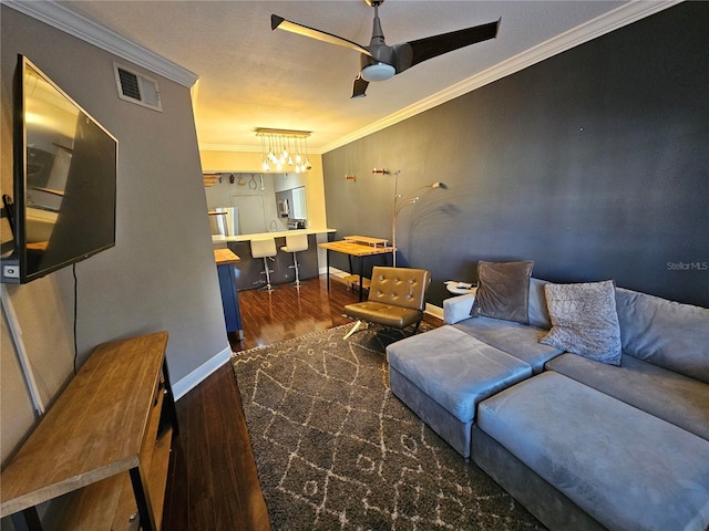 living room featuring crown molding, ceiling fan, and dark wood-type flooring