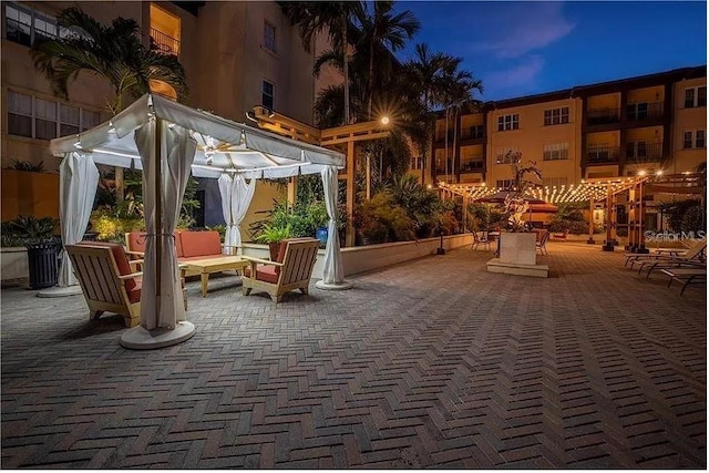 view of patio terrace at dusk