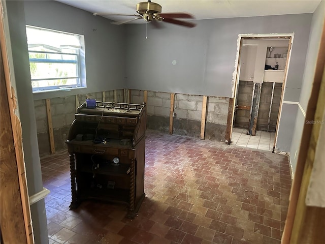 interior space featuring ceiling fan