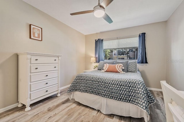 bedroom featuring light hardwood / wood-style flooring and ceiling fan