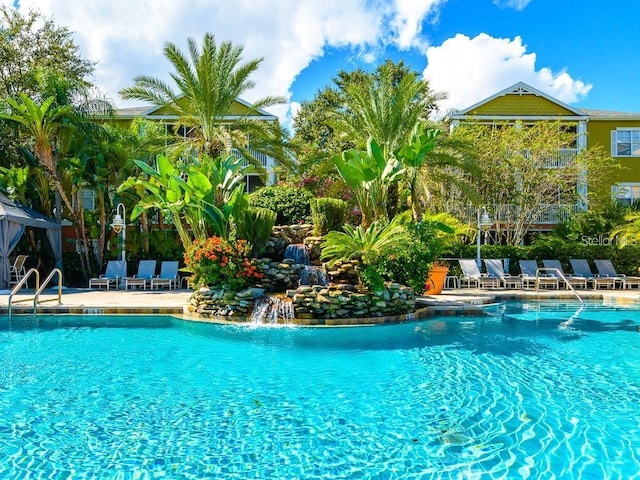 view of pool with pool water feature