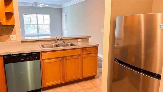 kitchen with stainless steel appliances, sink, crown molding, light tile patterned floors, and tasteful backsplash