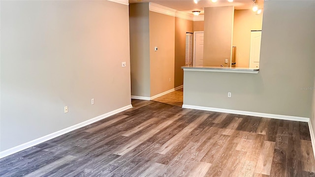 unfurnished room featuring crown molding and hardwood / wood-style flooring