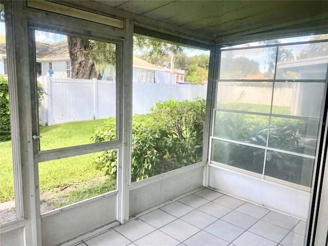 unfurnished sunroom with a healthy amount of sunlight