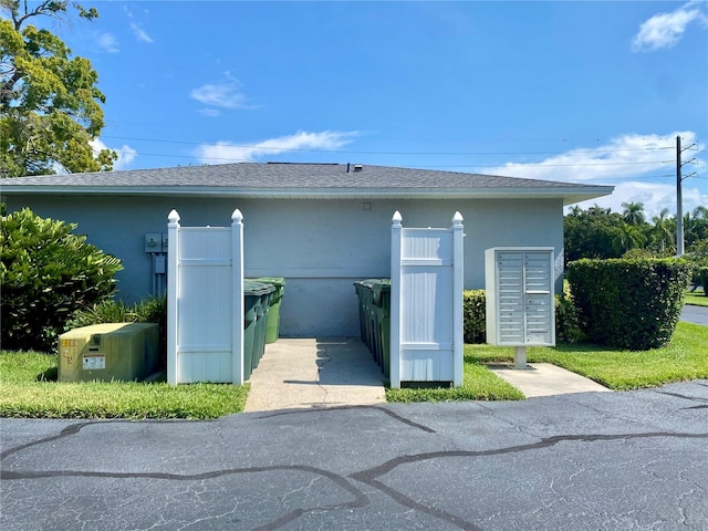 view of side of property featuring mail boxes