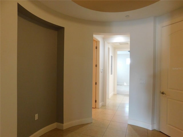 corridor featuring light tile patterned floors