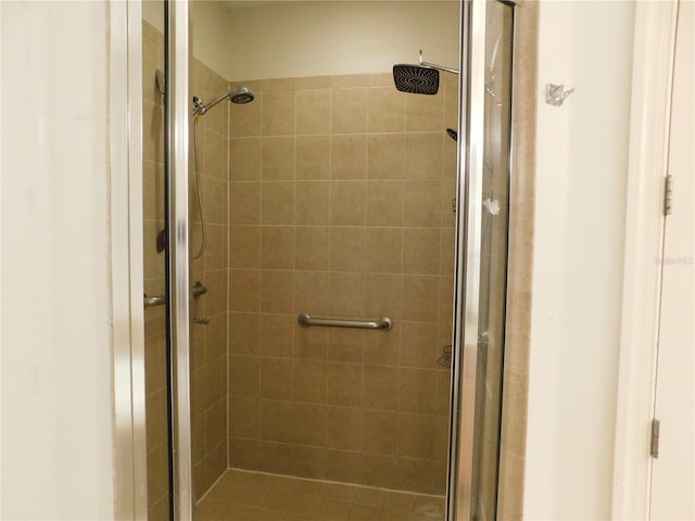 bathroom with a shower with shower door