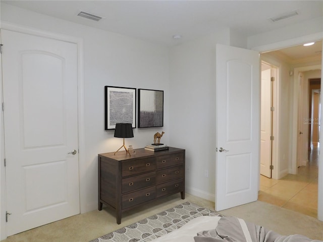 bedroom featuring light tile patterned flooring