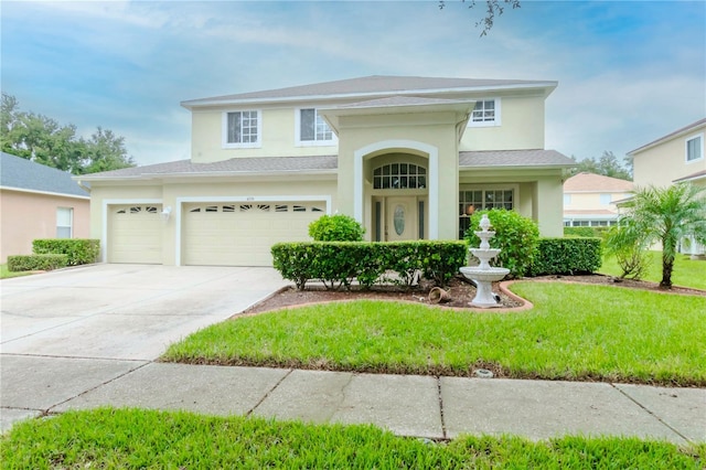 view of front facade with a front yard and a garage