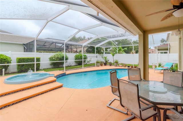 view of swimming pool with a patio area, pool water feature, and ceiling fan