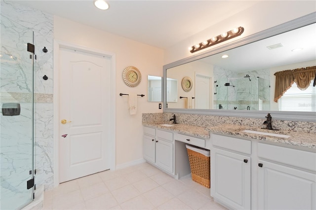 bathroom with vanity and an enclosed shower