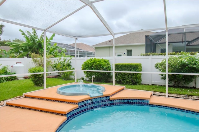 view of swimming pool with pool water feature and an in ground hot tub