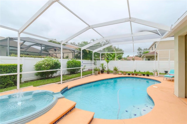 view of swimming pool featuring glass enclosure