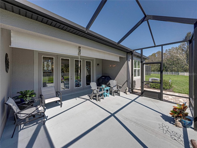 unfurnished sunroom featuring french doors