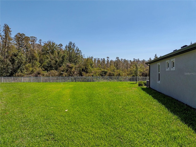 view of yard with central AC unit