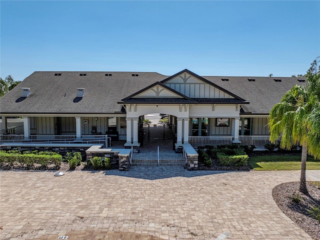 back of property with a porch