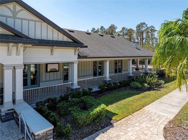 exterior space featuring a yard and a porch