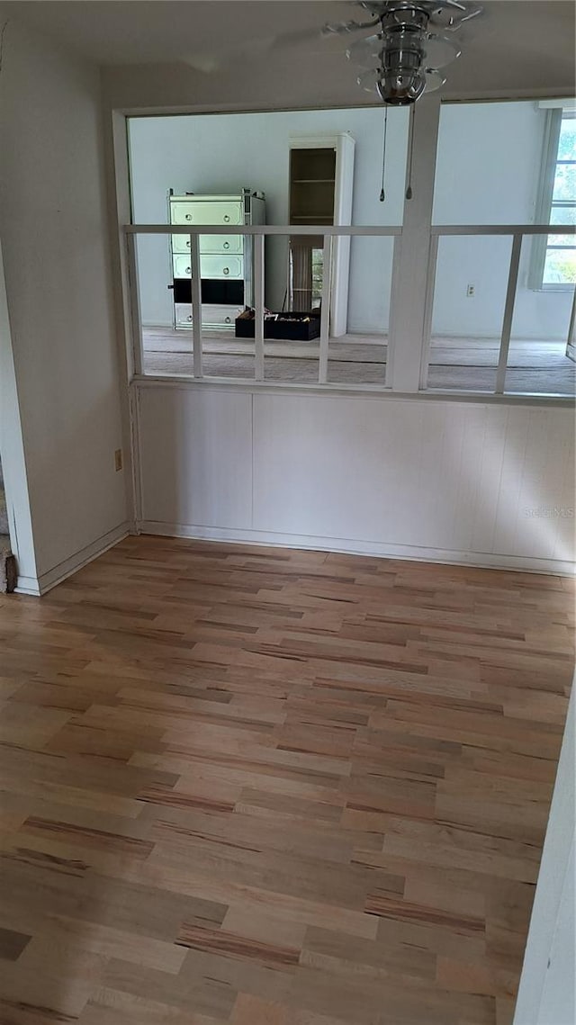 interior space with ceiling fan and hardwood / wood-style floors