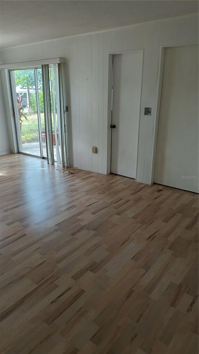 spare room with light wood-type flooring