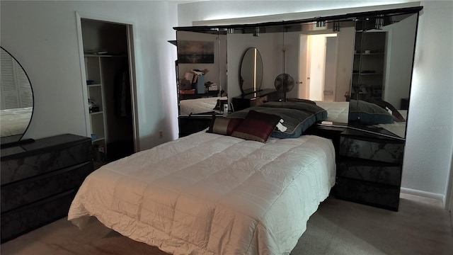 bedroom featuring a closet and carpet floors