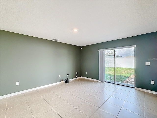 view of tiled spare room