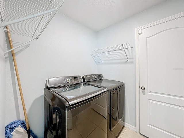 washroom with separate washer and dryer