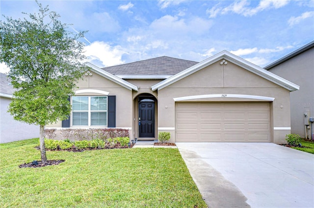 ranch-style home featuring a front yard and a garage