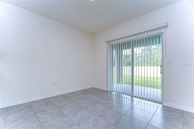 unfurnished room featuring tile patterned flooring