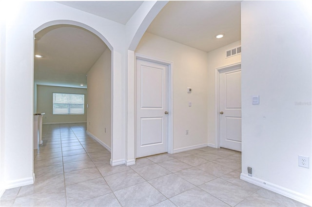 hallway featuring light tile patterned floors