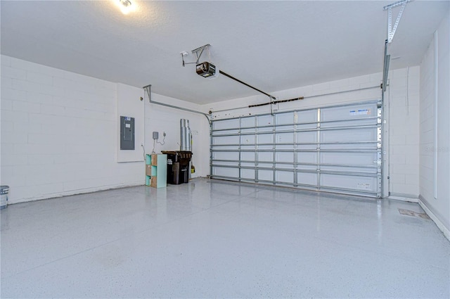 garage featuring electric panel and a garage door opener