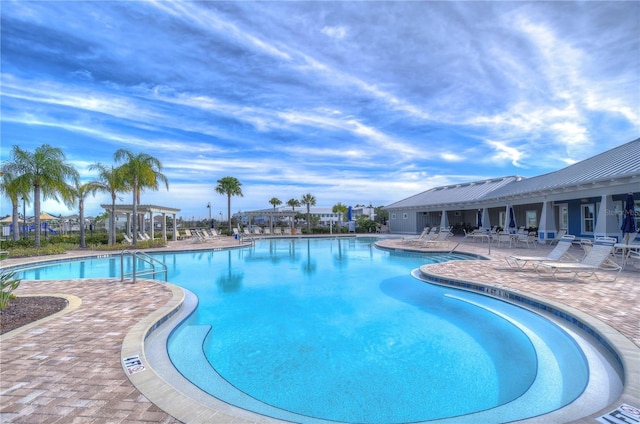 view of swimming pool featuring a patio