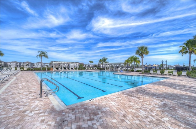 view of swimming pool with a patio