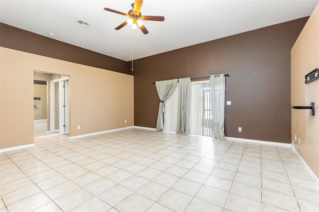 empty room featuring ceiling fan and light tile patterned floors