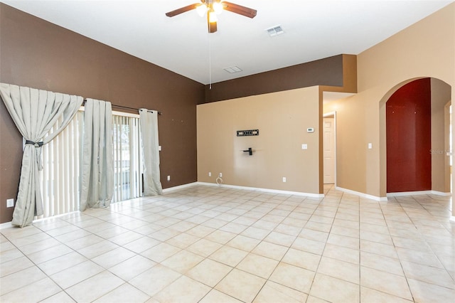 unfurnished room with light tile patterned floors and ceiling fan