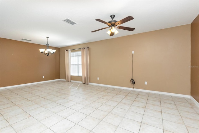 unfurnished room featuring ceiling fan with notable chandelier