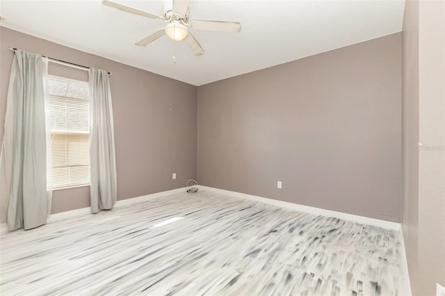 unfurnished room featuring ceiling fan and light hardwood / wood-style flooring