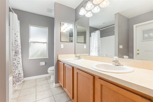 full bathroom featuring shower / bath combo, tile patterned flooring, vanity, and toilet