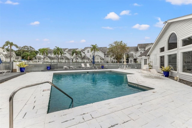 view of swimming pool with a patio area