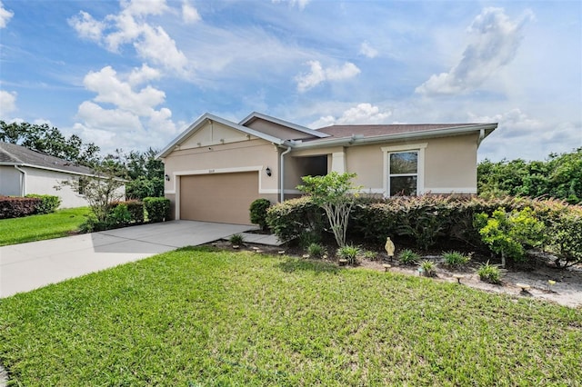 ranch-style house featuring a front lawn and a garage